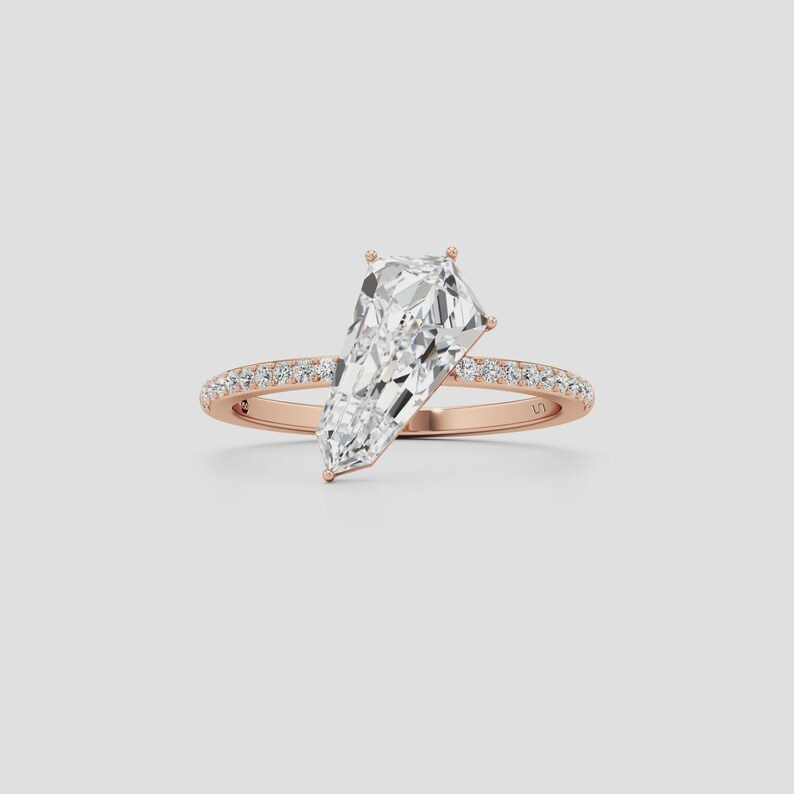Unique kite cut diamond bridal ring designed with a contemporary solitaire setting