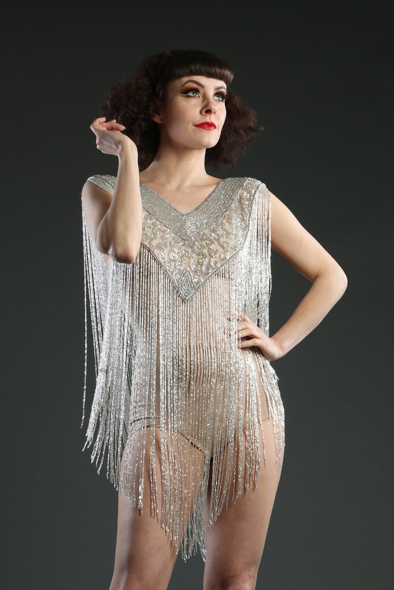 1920s Outfit Inspiration – Women’s 20s Costume Ideas 1920 Style Long Silver Embellished Beaded Great Gatsby Cape Fringe Top AT vintagedancer.com