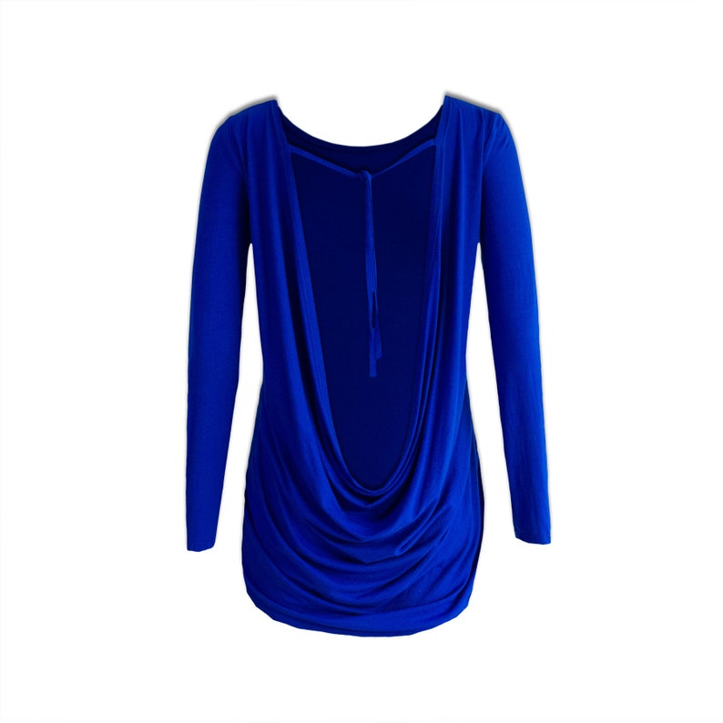 May include: A royal blue long-sleeved shirt with a cowl neck and a low back. The shirt is made of a soft, stretchy fabric and has a relaxed fit.
