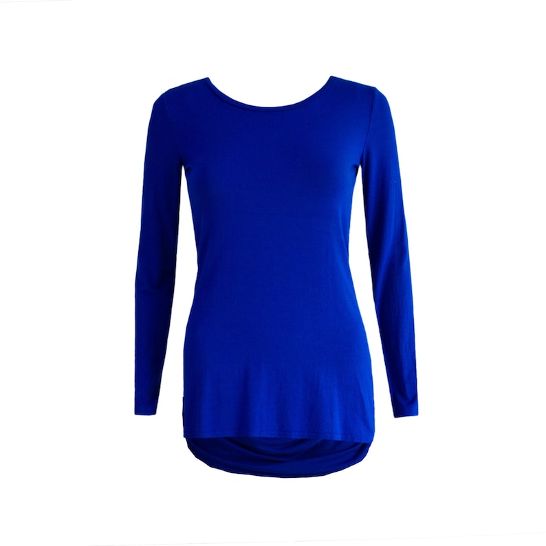 May include: A royal blue long-sleeved shirt with a rounded neckline and a slightly longer back hem.