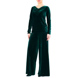 May include: A dark green velvet top with a cowl neck and long sleeves, paired with matching wide-leg pants.