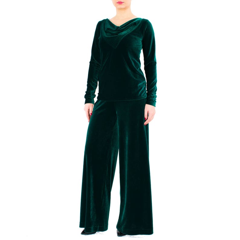 May include: A dark green velvet top with a cowl neck and long sleeves, paired with matching wide-leg pants.