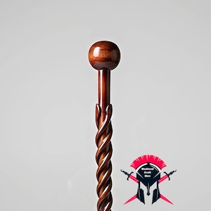 May include: A white ceramic mug with a black handle and the text "But First, Coffee" in a black, bold font. The mug is on a white surface.