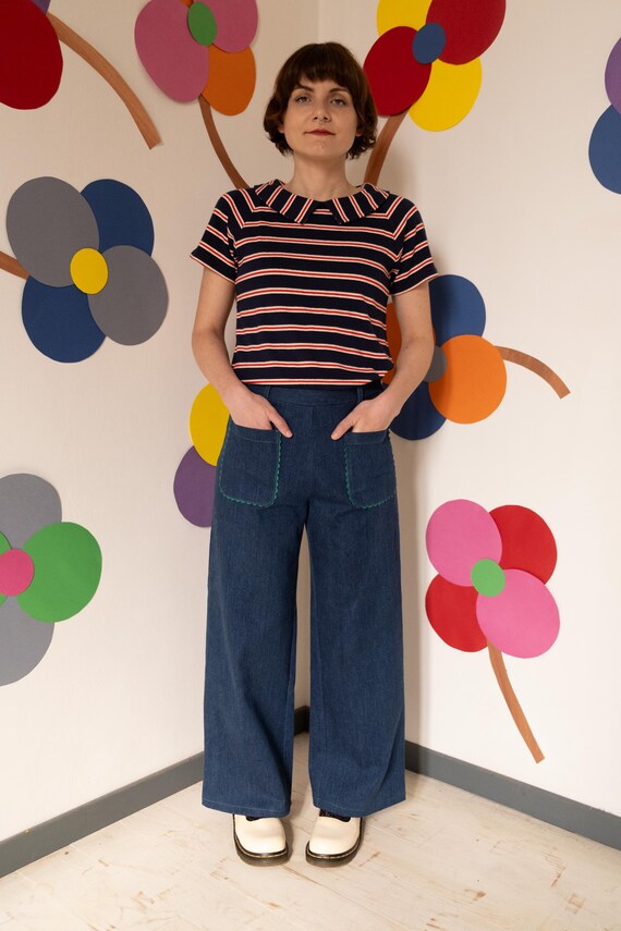 Pantaloni Palazzo in jeans blu con particolari verdi, tasche