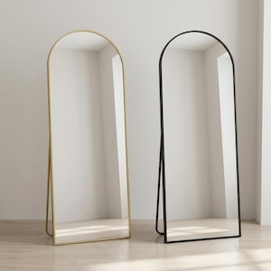 Arched full length mirror available in gold and black frame colors
