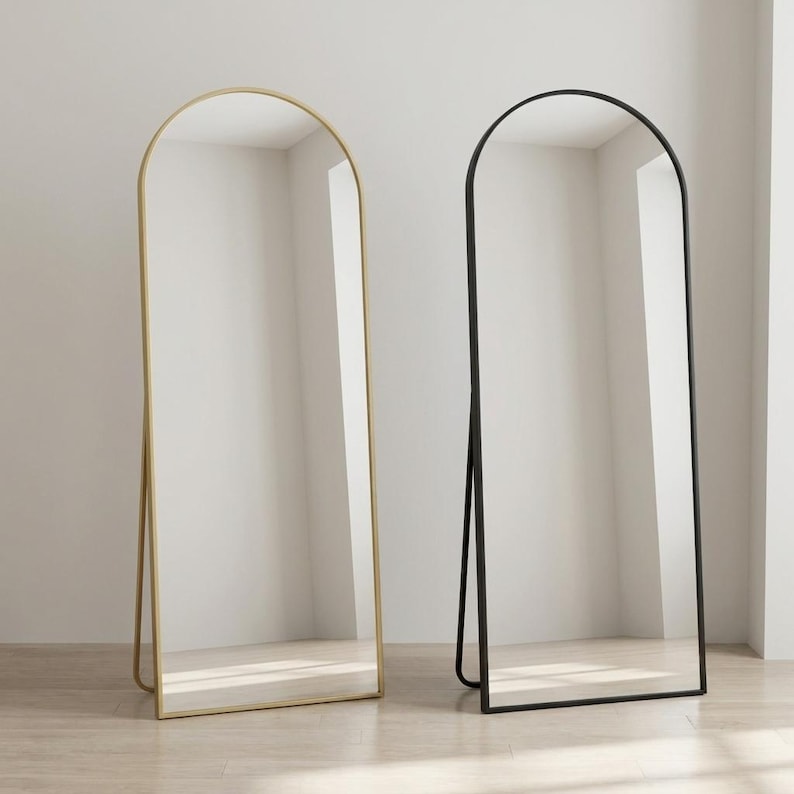 Arched full length mirror available in gold and black frame colors
