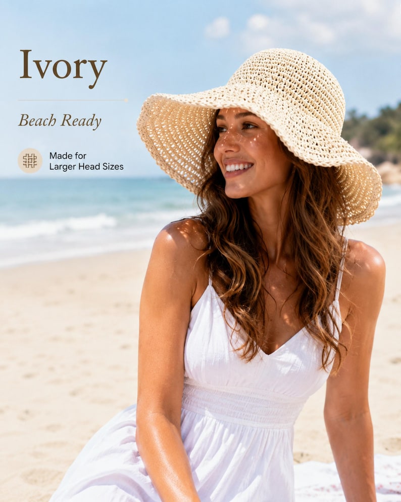 May include: An ivory-colored, wide-brimmed straw hat with a woven texture. The image includes the text Ivory, Beach Ready, and Made for Larger Head Sizes. The hat features a rounded crown and a flexible, downward-sloping brim.