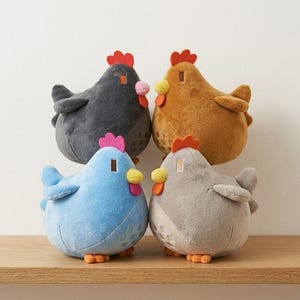 May include: Four plush chicken toys in various colors: dark gray, brown, light blue, and gray. Each chicken has a red comb, pink wattle, yellow beak, and orange feet. The chickens are sitting on a wooden shelf.
