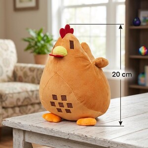 May include: A plush chicken toy, approximately 8 inches tall, sits on a white wooden table. The chicken is primarily orange with a red comb, yellow beak, and brown square accents. The toy has orange feet and a rounded body.