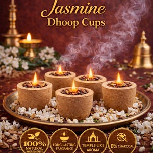 May include: Image of Jasmine Dhoop Cups. Five lit dhoop cups sit on a decorative tray surrounded by small white flowers. The text reads "Redolence - Natural Fragrance" and "Experience the Sacred Temple Fragrance". The image also shows icons for natural ingredients, long-lasting fragrance, temple-like aroma, and 0% charcoal.