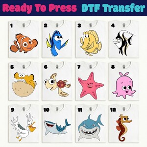 Puede incluir: Camisetas blancas con diseños de dibujos animados de criaturas marinas coloridas. Los diseños incluyen un pez payaso, un pez cirujano azul, un pez amarillo, un pez blanco y negro, un pez globo, una tortuga marina, una estrella de mar rosa, un pulpo rosa, un pelícano, un tiburón ballena, un tiburón y un caballito de mar. El texto en la parte superior dice "Ready To Press DTF Transfer".