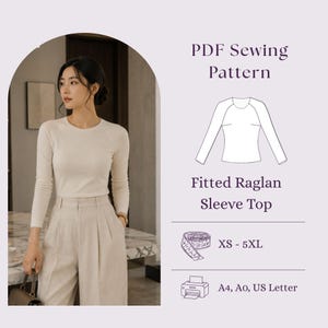 May include: A PDF sewing pattern for a fitted raglan sleeve top. The graphic includes a line drawing of the top, a measuring tape icon, and text indicating sizes XS-5XL, with compatibility for A4, A0, and US Letter paper formats for printing.