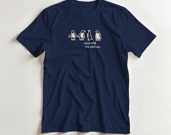 Maglietta grafica con pinguino: design "E ancora resistiamo"