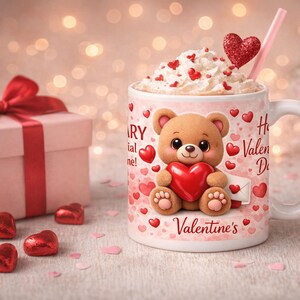 May include: A Valentine's Day themed image featuring a gift box with a red bow, a mug with a teddy bear design, and heart-shaped candies. The mug is filled with whipped cream and a heart-shaped decoration. The words "Happy Valentine's Day" are on the mug.