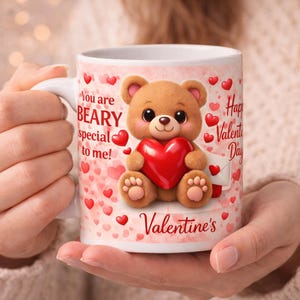 May include: White ceramic mug with a Valentine's Day theme. The mug features a cartoon teddy bear holding a red heart, surrounded by hearts. Text includes "You are BEARY special to me!" and "Happy Valentine's Day."