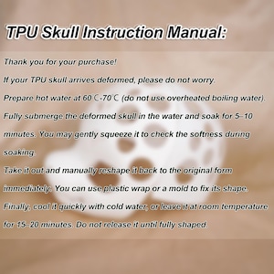 May include: Instruction manual for a TPU skull, with text in black font. The manual provides instructions on how to reshape a deformed skull using hot water, plastic wrap, and cold water. The background is a gradient of brown and white.