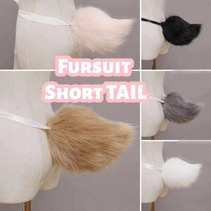 May include: A selection of faux fur fursuit short tails in different colours: pink, black, brown, grey, and white. Each tail is attached to a white ribbon. The text "FURSUIT SHORT TAIL" is displayed in pink.