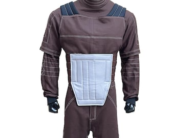 May include: A brown jumpsuit with white stitching and a high collar. The costume features a light gray chest plate and black accents on the shoulders and gloves. The outfit is designed for a mannequin.
