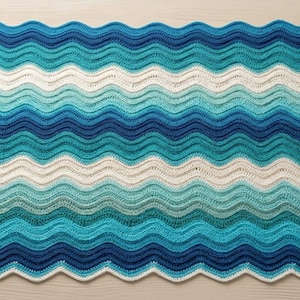 May include: A set of three ceramic mugs with a speckled, matte finish. The mugs are in shades of cream, light gray, and dark gray. Each mug has a simple, minimalist design, perfect for coffee or tea.