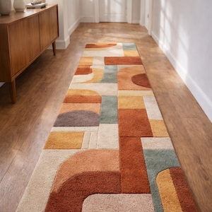 May include: A rectangular hallway rug with a geometric pattern in shades of brown, orange, beige, and teal. The rug features a mix of curved and rectangular shapes. The text "KhusiRugStudio" is visible on the rug.