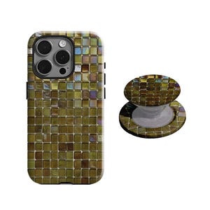 May include: A phone case and a phone grip with a mosaic tile design in shades of green, gold, and brown. The phone case is rectangular with a camera cutout. The phone grip is round and has a white base.