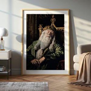 May include: A framed print featuring an elderly man with a long white beard and a green robe, seated in a throne-like chair. The man is wearing a hat and appears to be asleep. The artwork is in a gold frame.