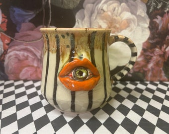 Orange lip eyeball mug