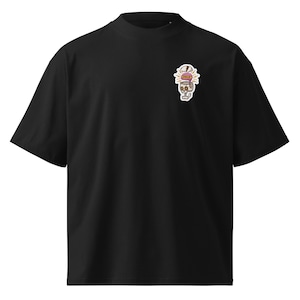 May include: Black t-shirt with a small, colorful graphic on the upper left chest. The graphic is a skull wearing a hat with the word "ERROR" on it. The shirt has short sleeves and a crew neck.