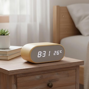 May include: A set of three ceramic mugs with a speckled, matte finish. The mugs are in shades of cream, light gray, and dark gray. Each mug has a simple, minimalist design, perfect for coffee or tea.