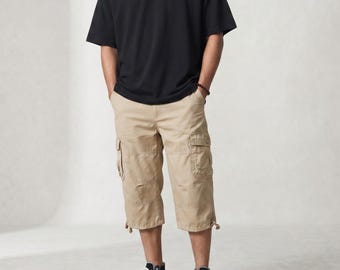 Pantalones cortos cargo de algodón para hombre, pantalones capri de verano, pantalones hasta la rodilla, estilo urbano de corte holgado, pantalones cortos tácticos con múltiples bolsillos.