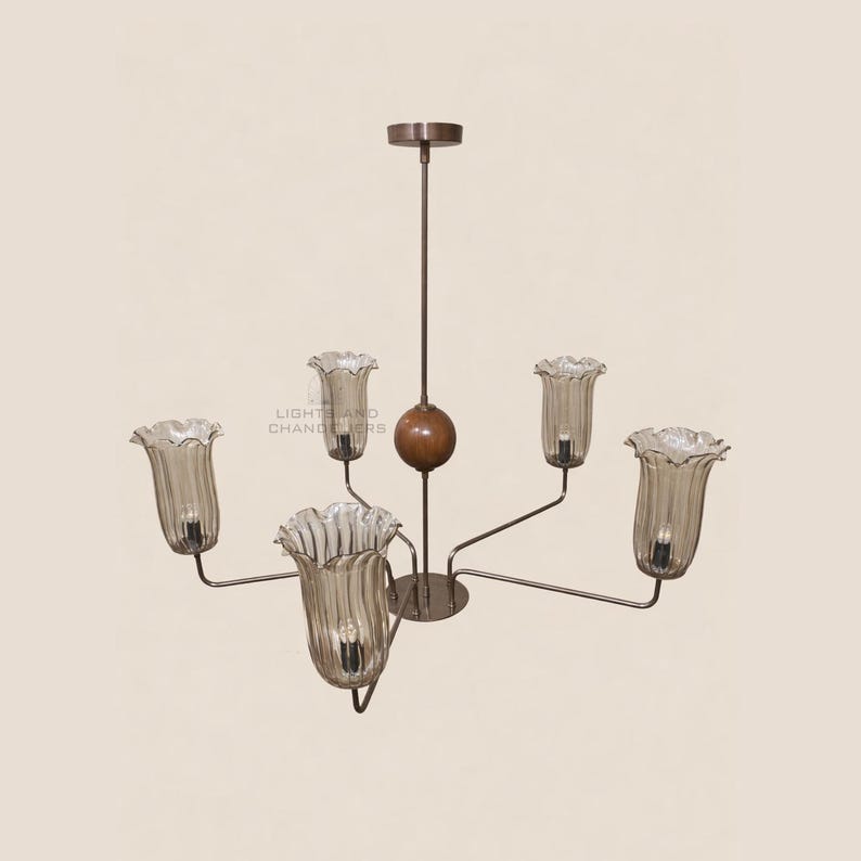 May include: A vintage-style chandelier with six light fixtures. The light fixtures are shaped like tulip flowers with a ruffled edge. The chandelier has a brown metal frame and a wooden sphere in the center. The text "LIGHT AND CHANDELIERS" is visible.