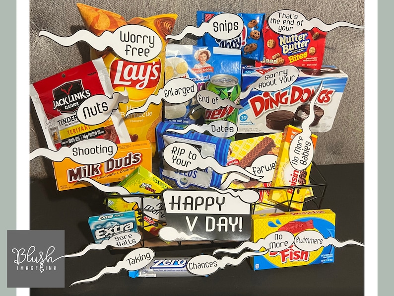 May include: A black wire basket filled with a variety of snack foods, including Lay's potato chips, Milk Duds, Ding Dongs, and Nutter Butter Bites. The basket is decorated with speech bubbles that say "Happy V Day!" and other humorous phrases.