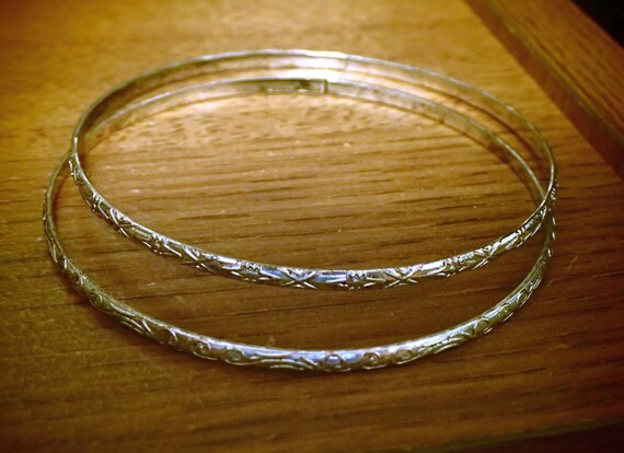 Two Bangle Sterling Silver Bracelets. Nicely decorated