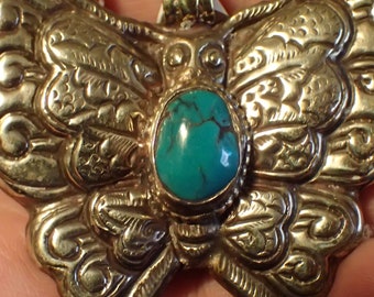 Turquoise Butterfly Repousse Pendant in Tibetan Silver