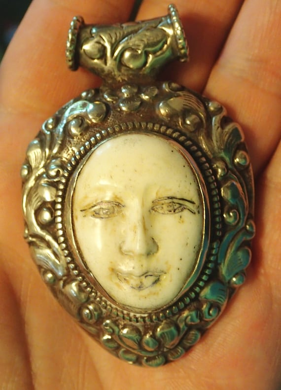 Goddess Face Pendant in Tibetan Silver Repousse