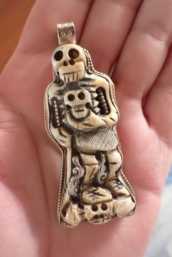 Carved Skeleton with skull head Pendant