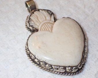 Flaming Heart Carved Pendant in tibetan silver