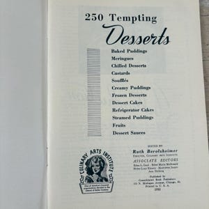 May include: Open book page with the title "250 Tempting Desserts" in elegant script. The page lists dessert categories like "Baked Puddings" and "Dessert Cakes." A Culinary Arts Institute logo and editor information are also visible.