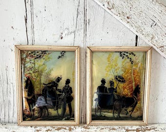 Silueta de pintura de vidrio invertido negro sobre par de burbujas convexas de dos