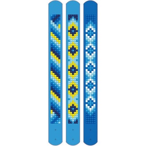 May include: Three blue and yellow patterned bracelets. Each bracelet has a different pattern. The bracelets are made of small beads.