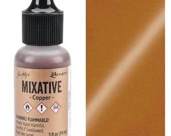 May include: A bottle of Ranger Tim Holtz Mixative in copper color with a black cap. The label displays the text Mixative Copper, warning symbols, and the volume of .5 fl oz (14 ml). Next to the bottle is a rectangular swatch of the copper paint.