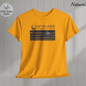 May include: A set of three ceramic mugs with a speckled, matte finish. The mugs are in shades of cream, light gray, and dark gray. Each mug has a simple, minimalist design, perfect for coffee or tea.