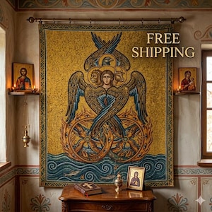 May include: A large rectangular wall tapestry featuring a central golden figure with multiple wings, a human face, a lion head, an ox head, and an eagle head, positioned above two interlocking wheels with eyes, set against a textured yellow background.