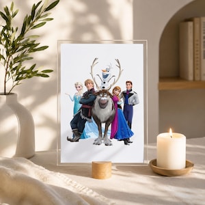 May include: A rectangular acrylic frame displays a printed illustration of the characters Elsa, Kristoff, Sven the reindeer, Olaf the snowman, Anna, and Hans standing together against a plain white background in a group portrait composition.