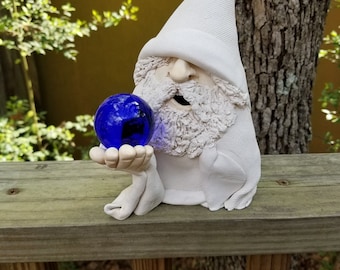 White Wizard Holding a Colored Crystal Ball