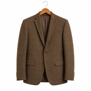 May include: A brown tweed blazer with a subtle plaid pattern, hanging on a wooden hanger. The jacket features two front pockets, a two-button closure, and buttons on the sleeves. The interior lining is a solid brown color.