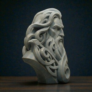 May include: A grey stone-colored bust sculpture depicting a bearded figure with long flowing hair that integrates into intricate knotwork patterns. A small bird is perched on the side of the figure's shoulder, blending into the sculpted hair.