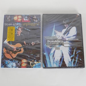 Könnte beinhalten: Ein Set aus drei Keramikbechern mit gesprenkelter, matter Oberfläche. Die Becher sind in Creme-, Hellgrau- und Dunkelgrautönen gehalten. Jeder Becher hat ein schlichtes, minimalistisches Design.