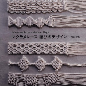 May include: A book cover featuring various macrame designs in off-white thread. The designs include intricate patterns of knots and loops, with the title "Macrame Accessories and Bags" and Japanese text. The background is a neutral gray.