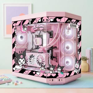 May include: Pink computer case with a clear side panel, featuring a "Kuromi" theme. The case has black and pink diagonal stripes, heart and skull accents, and illustrations of the character. The internal components are visible, with pink and white components and fans.